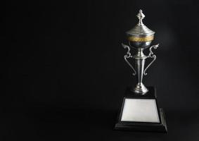 Trophy award on black background photo