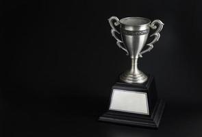 Trophy award on black background photo