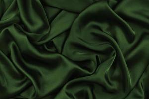 Background fabric. Dark textile fabric with texture and pattern drapery background photo