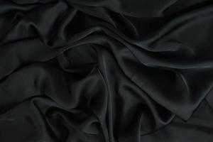 tela de fondo. Tejido textil oscuro con textura y patrón de fondo de cortinas foto