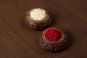 Kumkum and rice grain container. Natural color powders are used while worshipping God and an at auspicious occasions. photo