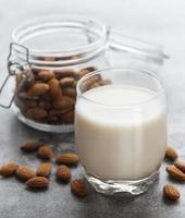 Almond milk and almonds photo