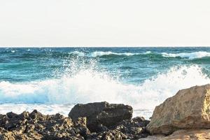 The coast of the Mediterranean Sea. The waves. The horizon. Sky and sea in summer photo