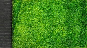 artificial grass turf for sports fields green lawn mockup with copy space photo