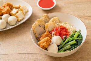 Egg noodles with fish balls and shrimp balls in pink sauce, Yen Ta Four or Yen Ta Fo - Asian food style