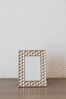 Empty picture frame decoration on white wall with copy space