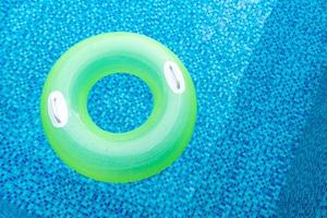 Swim ring in blue swimming pool photo