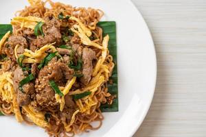 Stir-fried instant noodle with pork and egg - Asian local street food style