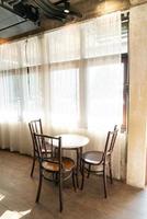 Empty table and chair in coffee shop cafe and restaurant photo