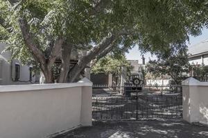 Cottage with garden and fences in Cape Town, South Africa. photo