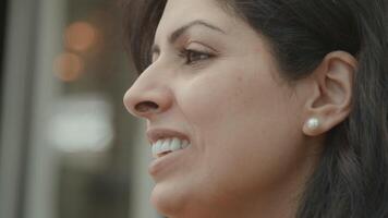 Woman sitting outside having conversation video