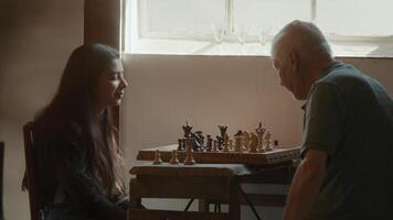 Girl and man playing chess whilst man doubts about next move video