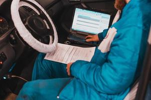 Computer diagnostics of the onboard computer in the car in a car dealership. photo