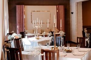 the presidium of the newlyweds in the banquet hall of the restaurant photo