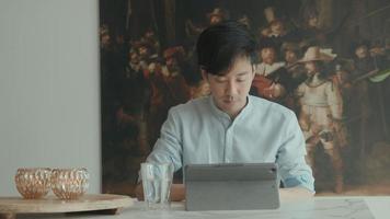 Man using laptop at table video