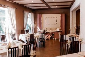 the presidium of the newlyweds in the banquet hall of the restaurant photo