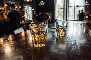 glasses of whiskey on the table photo