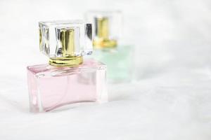 Perfume bottle on white fur photo