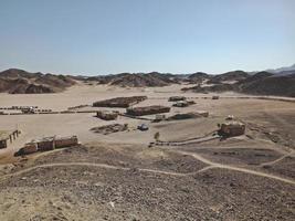 Small buildings in the desert of Egypt photo