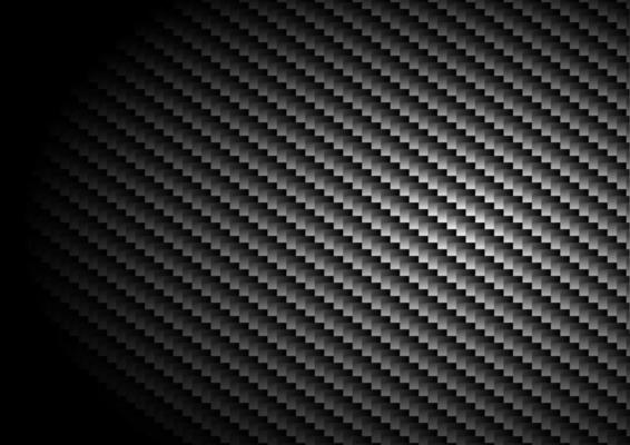 Black carbon fiber background and texture with lighting.