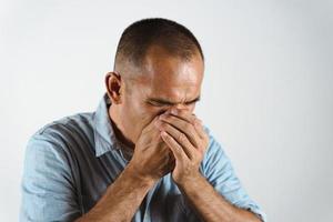 Man sneezing or coughing over his hand to prevent spread the virus COVID-19 or Corona Virus on white background. photo