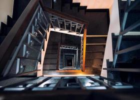 Frame square of vintage spiral staircase with light shiny photo