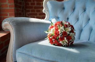 Bridal bouquet in soft antique chair photo