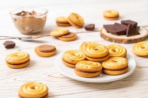 Sandwich cookies with chocolate cream photo