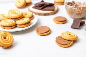 Sandwich cookies with chocolate cream photo