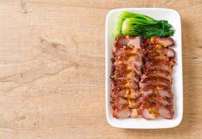 Roast barbecue red pork with sauce photo