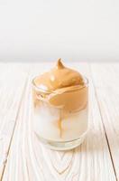 Iced Dalgona Coffee, a trendy fluffy creamy whipped coffee photo