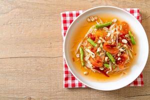 Papaya spicy salad - somtam - Thai traditional street food style photo