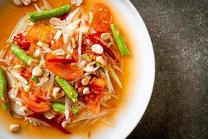 Papaya spicy salad - somtam - Thai traditional street food style photo