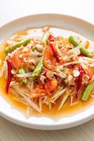 Papaya spicy salad - somtam - Thai traditional street food style photo