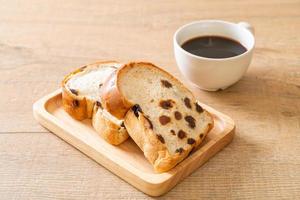 Raisin bread with coffee cup for breakfast photo