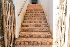 Outdoor brick stair step with white wall photo