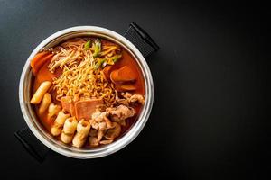 Budae Jjigae or Budaejjigae Army stew or Army base stew. It is loaded with Kimchi, spam, sausages, ramen noodles and much more photo