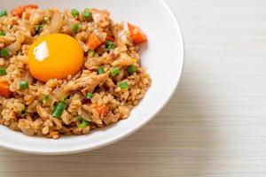 Salmon fried rice with pickled egg on top - Asian food style photo