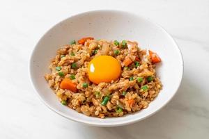 Salmon fried rice with pickled egg on top - Asian food style photo