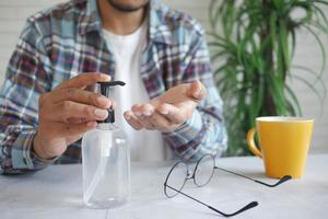Using sanitizer liquid for preventing corona virus photo