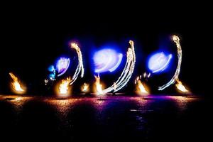 fiery pieces of a fire show photo