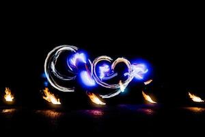 fiery pieces of a fire show photo