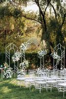 wedding ceremony area with dried flowers in a meadow photo
