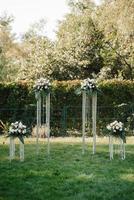 wedding ceremony in the woods among the trees on the green track photo