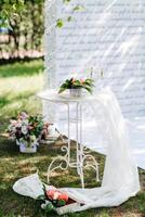 wedding ceremony in the woods among the trees on the green track photo