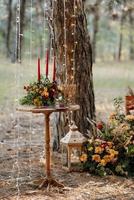 atmospheric candle decor with live fire on the banquet table photo