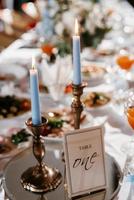 atmospheric candle decor with live fire on the banquet table photo