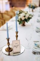 atmospheric candle decor with live fire on the banquet table photo