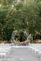 wedding ceremony area, arch chairs decor photo