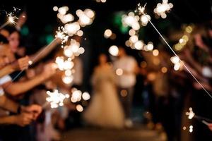 sparklers at the wedding,  on the background photo